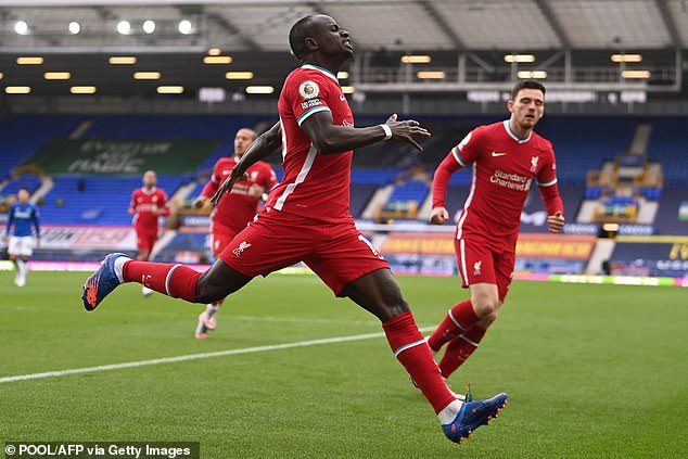 34506518-8846761-Sadio_Mane_celebrates_after_firing_Liverpool_into_an_early_lead_-a-1_1602941564191