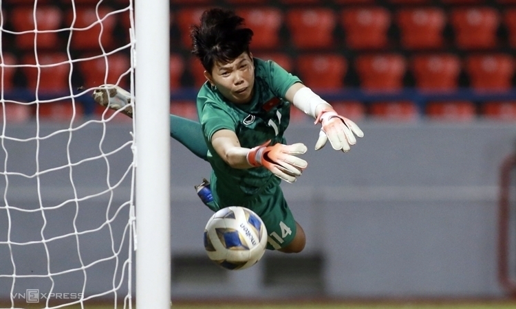 Goalkeeper Kim Thanh makes a save during Vietnam's Olympic qualification match against Australia