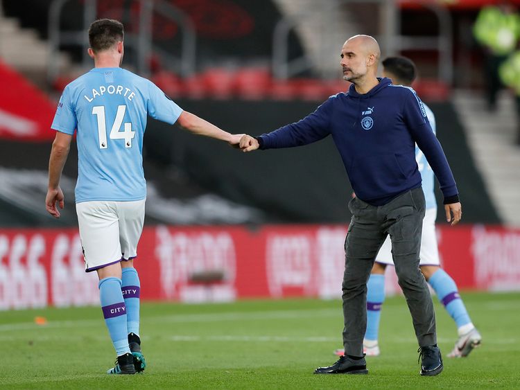 Manchester-City-s-head-coach-Pep-Guardiola-with-Aymeric-Laporte._17323684c83_large